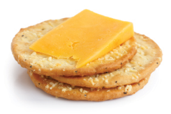 Three golden cheese crackers on white  With cheese 